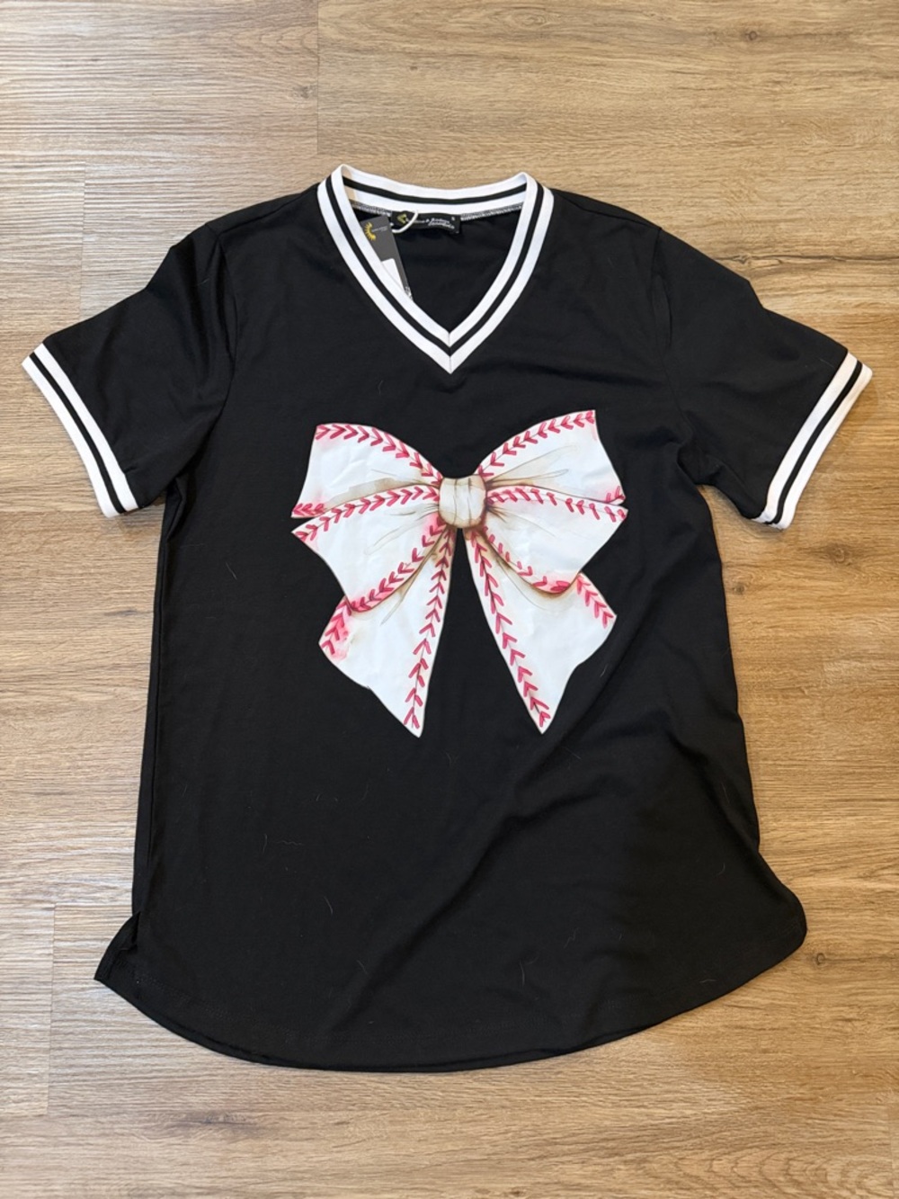 Sunshine and Rodeo Black V-Neck Tee with White & Pink Bow Graphic